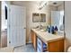 Neutral bathroom featuring a single sink vanity with storage and toilet at 202 Napoli Dr # 202, Davenport, FL 33897