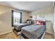 Comfortable bedroom featuring two twin beds, soft carpeting, and natural light from the window at 202 Napoli Dr # 202, Davenport, FL 33897
