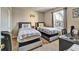 Bright bedroom provides two twin beds, a window, and desk, blending comfort and functionality seamlessly at 202 Napoli Dr # 202, Davenport, FL 33897