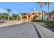Inviting Regal Palms clubhouse with palm trees and a well-manicured landscape at 202 Napoli Dr # 202, Davenport, FL 33897