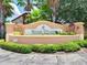 Elegant community entrance sign for Regal Palms at Highland's Reserve, surrounded by lush greenery at 202 Napoli Dr # 202, Davenport, FL 33897