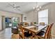 Bright dining room with a large table, comfortable seating, and sliding glass doors to the patio at 202 Napoli Dr # 202, Davenport, FL 33897