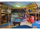 The game room offers a pool table, arcade games and a fun play structure at 202 Napoli Dr # 202, Davenport, FL 33897