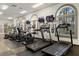 Bright fitness center with modern cardio equipment, large windows, and mirrored walls for an energizing workout at 202 Napoli Dr # 202, Davenport, FL 33897