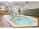 Indoor hot tub with tile flooring, large windows and entry to the exercise room at 202 Napoli Dr # 202, Davenport, FL 33897
