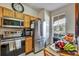 Well-equipped kitchen with stainless steel appliances and natural light from a window at 202 Napoli Dr # 202, Davenport, FL 33897