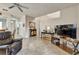 Open-concept living room with tile floors, staircase, and contemporary furnishings at 202 Napoli Dr # 202, Davenport, FL 33897