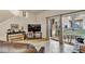 Cozy living room with a comfortable leather sofa and sliding glass doors leading to the patio at 202 Napoli Dr # 202, Davenport, FL 33897