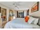 Bright bedroom featuring carpet floors, ceiling fan, modern decor, and a sliding glass door to the balcony at 202 Napoli Dr # 202, Davenport, FL 33897