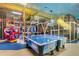 A colorful play area featuring air hockey tables, arcade games and climbing structure for hours of fun at 202 Napoli Dr # 202, Davenport, FL 33897