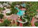 Community pool area with water slides, palm trees, and tropical landscaping at 202 Napoli Dr # 202, Davenport, FL 33897