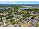 Aerial view of neighborhood showing the home's location near lakes and trees at 2024 Beardsley Dr, Apopka, FL 32703