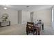 Open-concept dining area with natural light, neutral color palette, and tile flooring at 2024 Beardsley Dr, Apopka, FL 32703