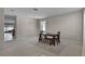 Spacious dining room with a dark wood table, neutral walls, and a patterned rug at 2024 Beardsley Dr, Apopka, FL 32703