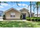 Inviting single-story home featuring manicured landscaping, green lawn, and neutral exterior paint at 2024 Beardsley Dr, Apopka, FL 32703