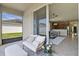 Comfortable outdoor seating with the kitchen and living room visible through patio door at 2024 Beardsley Dr, Apopka, FL 32703