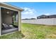 A cozy screened patio with views of a well-kept fenced backyard at 2024 Beardsley Dr, Apopka, FL 32703
