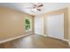 Bright bedroom with wood flooring, a ceiling fan, a window and closet doors at 2074 S Parkton Dr, Deltona, FL 32725