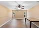 Open dining area with wood floors, neutral paint, and ceiling fan for a bright and inviting space at 2074 S Parkton Dr, Deltona, FL 32725