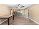 Open dining area with wood floors, and a seamless connection to the kitchen, offering a modern layout at 2074 S Parkton Dr, Deltona, FL 32725