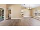 Spacious living room with hard wood floors, neutral walls, and backyard access at 2074 S Parkton Dr, Deltona, FL 32725