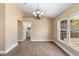 Open living room features hard wood floors with laundry room in the distance at 2074 S Parkton Dr, Deltona, FL 32725