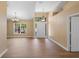 The living room features vaulted ceilings, hardwood floors and natural light at 2074 S Parkton Dr, Deltona, FL 32725