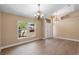 Bright living room showcasing hard wood floors, vaulted ceilings and neutral walls at 2074 S Parkton Dr, Deltona, FL 32725