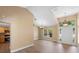 Bright living room boasts neutral walls, hardwood floors, and decorative lighting fixtures at 2074 S Parkton Dr, Deltona, FL 32725