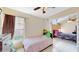 Bright, cozy bedroom with natural light, a single bed, and a view into another room, offering comfortable living at 2108 Shannon Lakes Blvd, Kissimmee, FL 34743