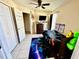 Comfortable bedroom featuring tile floors, a ceiling fan, and a window view at 2108 Shannon Lakes Blvd, Kissimmee, FL 34743