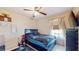 Welcoming bedroom with natural light, a ceiling fan, and tiled floors at 2108 Shannon Lakes Blvd, Kissimmee, FL 34743