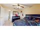 Charming bedroom featuring a comfortable bed, dresser, and ensuite bathroom access at 2108 Shannon Lakes Blvd, Kissimmee, FL 34743