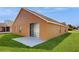 Beautiful exterior with a well-maintained lawn and a patio area at 2108 Shannon Lakes Blvd, Kissimmee, FL 34743