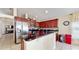 Modern kitchen features stainless steel appliances and a breakfast bar island at 2108 Shannon Lakes Blvd, Kissimmee, FL 34743