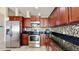 Well-appointed kitchen features stainless steel appliances and granite counters at 2108 Shannon Lakes Blvd, Kissimmee, FL 34743