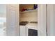 Convenient laundry closet area features a washer and dryer at 2108 Shannon Lakes Blvd, Kissimmee, FL 34743