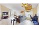 Bright living room features large windows, tile flooring, a ceiling fan, and comfortable seating arrangement at 2108 Shannon Lakes Blvd, Kissimmee, FL 34743