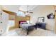 Spacious bedroom with vaulted ceilings, modern lighting, and plush carpet at 2108 Shannon Lakes Blvd, Kissimmee, FL 34743