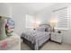 Cozy bedroom features a comfortable bed, soft lighting, and stylish decor, creating a relaxing ambiance at 2524 Datura Loop, St Cloud, FL 34772