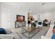 Bright living room with an open floor plan showcasing the dining and kitchen area at 2524 Datura Loop, St Cloud, FL 34772