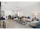 Spacious living room with modern decor and neutral-toned tile floors at 2524 Datura Loop, St Cloud, FL 34772