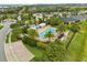 Community pool features a lounge area and tropical palm trees, creating a refreshing oasis at 2524 Datura Loop, St Cloud, FL 34772