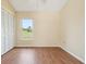 Bedroom featuring wood floors, a closet, and a window with a view of the landscape at 2598 Ekana Dr, Oviedo, FL 32765