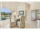 Bright breakfast nook with view of the pool, featuring a glass table and floral chairs at 2598 Ekana Dr, Oviedo, FL 32765