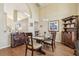 Dining room with hardwood floors, dark wood furnishings, and a view to the living room at 2598 Ekana Dr, Oviedo, FL 32765
