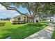 Inviting single-story home boasts lush green lawn, beautiful landscaping, and a spacious driveway at 2598 Ekana Dr, Oviedo, FL 32765