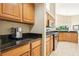 Well-lit kitchen featuring granite countertops, stainless steel appliances and tile floors at 2598 Ekana Dr, Oviedo, FL 32765