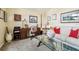Comfortable living room featuring a desk area, large window, and neutral decor at 2598 Ekana Dr, Oviedo, FL 32765