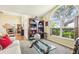 Inviting living room with a large window, dining room view, and hardwood floors at 2598 Ekana Dr, Oviedo, FL 32765